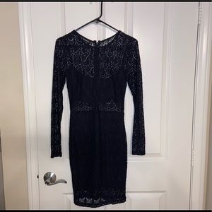 Black laced Bebe long sleeved mini dress